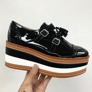 Black patent striped loafer